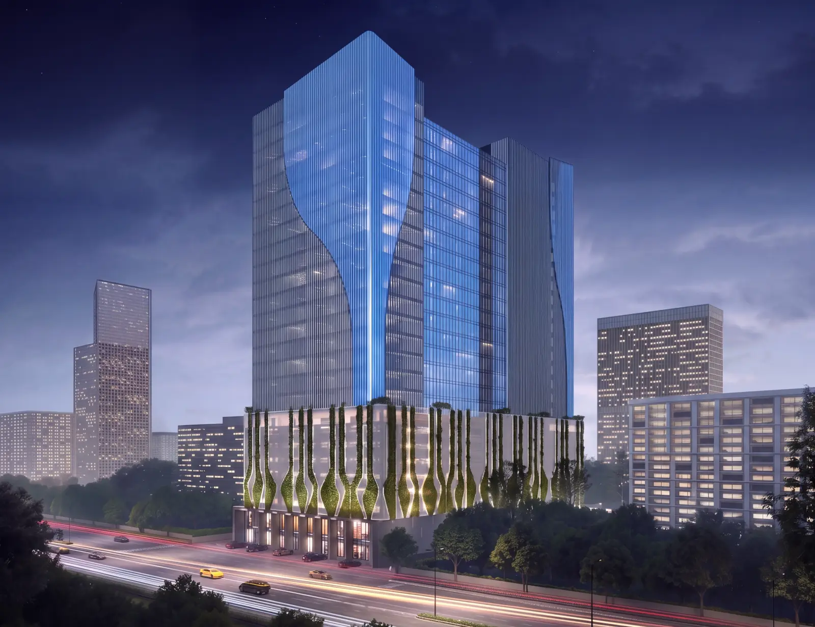Curved glass office tower at night above a planted podium, Nerul MIDC